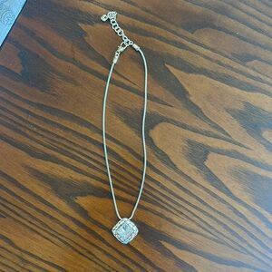 Elegant Silver Necklace with Intricate Pendant